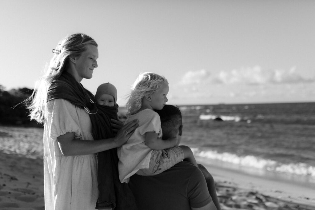 Black and white photo of family on the beach at golden hour in Maui. Hawaii