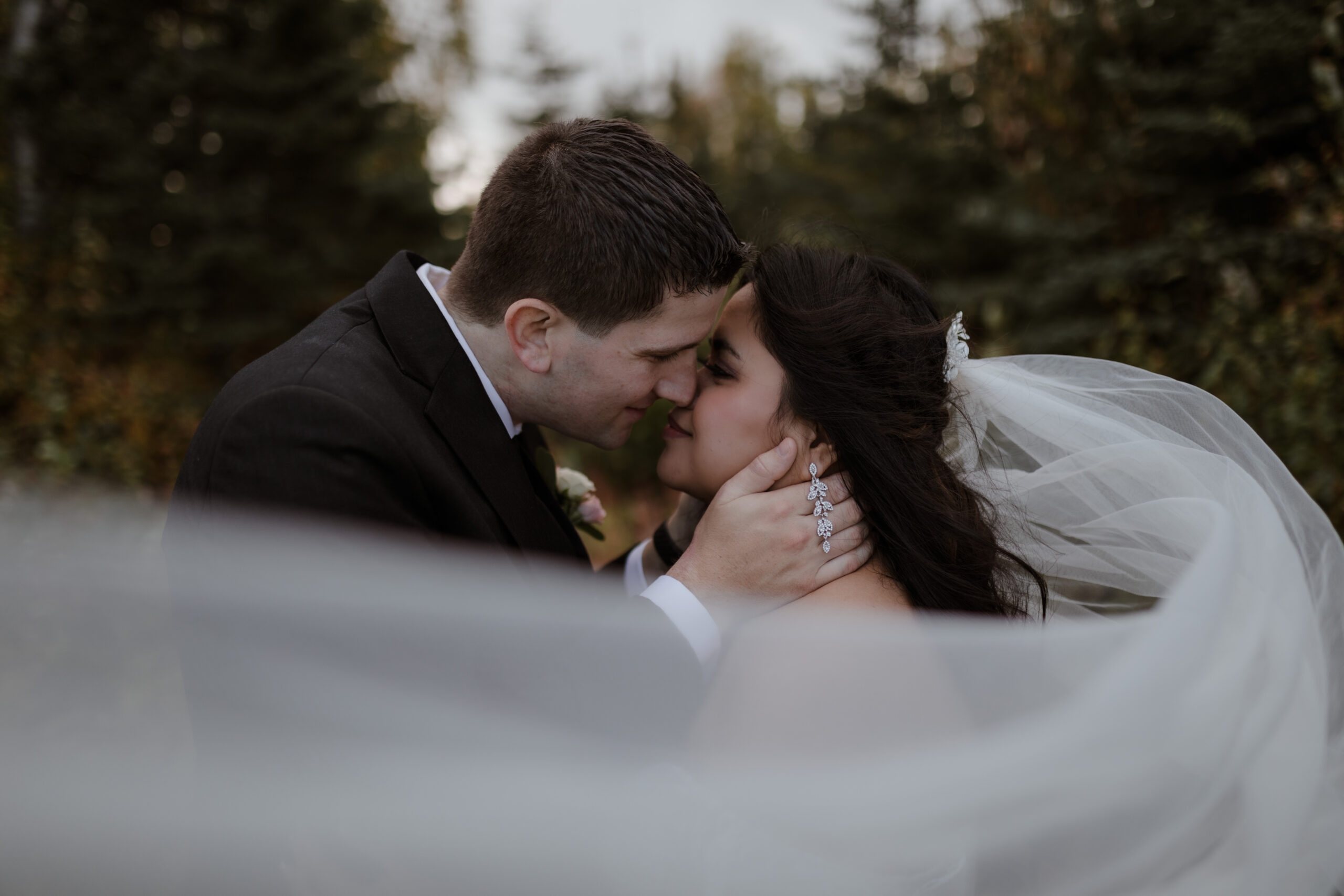 Bride and groom embracing at Alaska Wedding Venue in Alaska