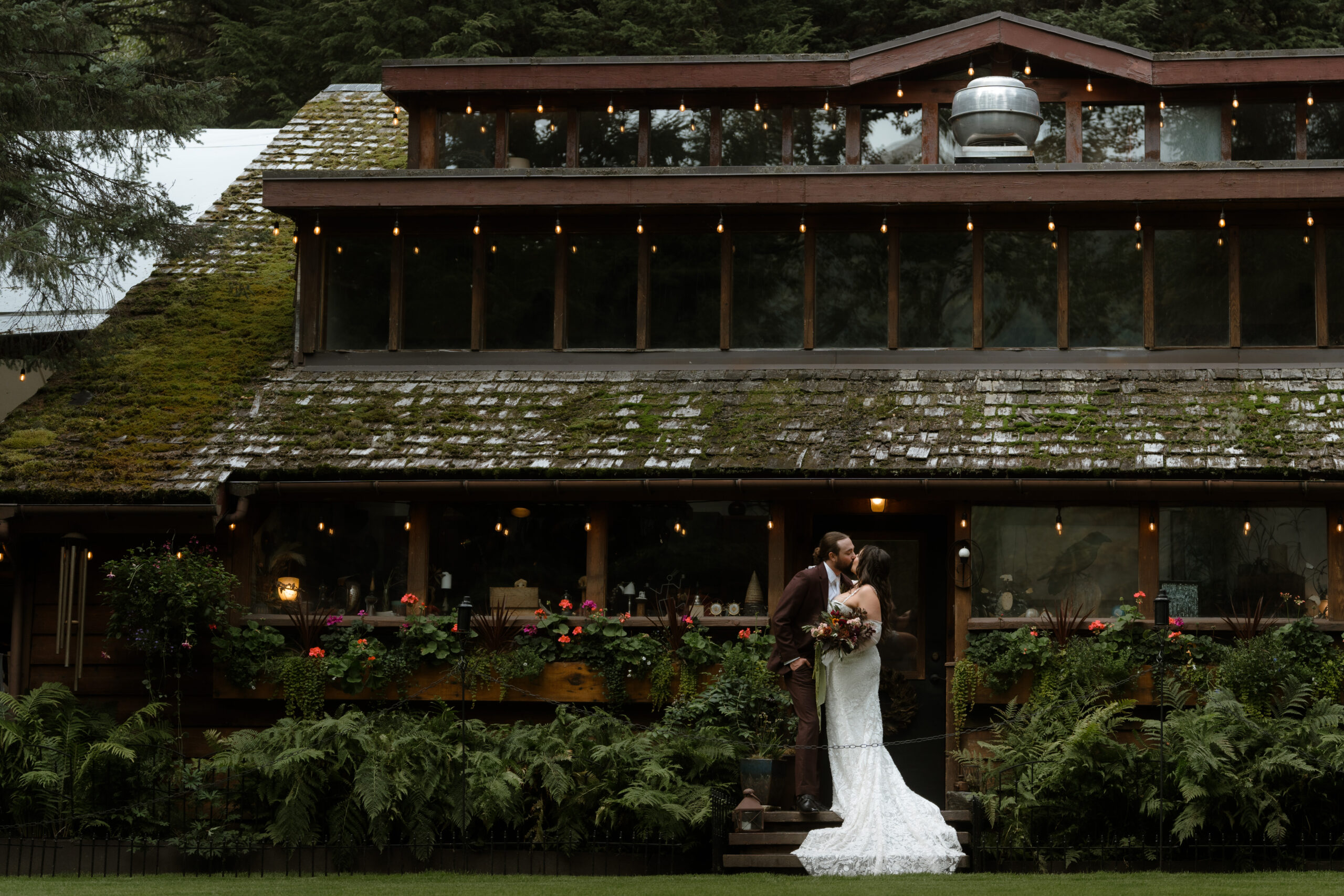 Bride and groom kissing at Raven Glacier Lodge in Girdwood, Alaska